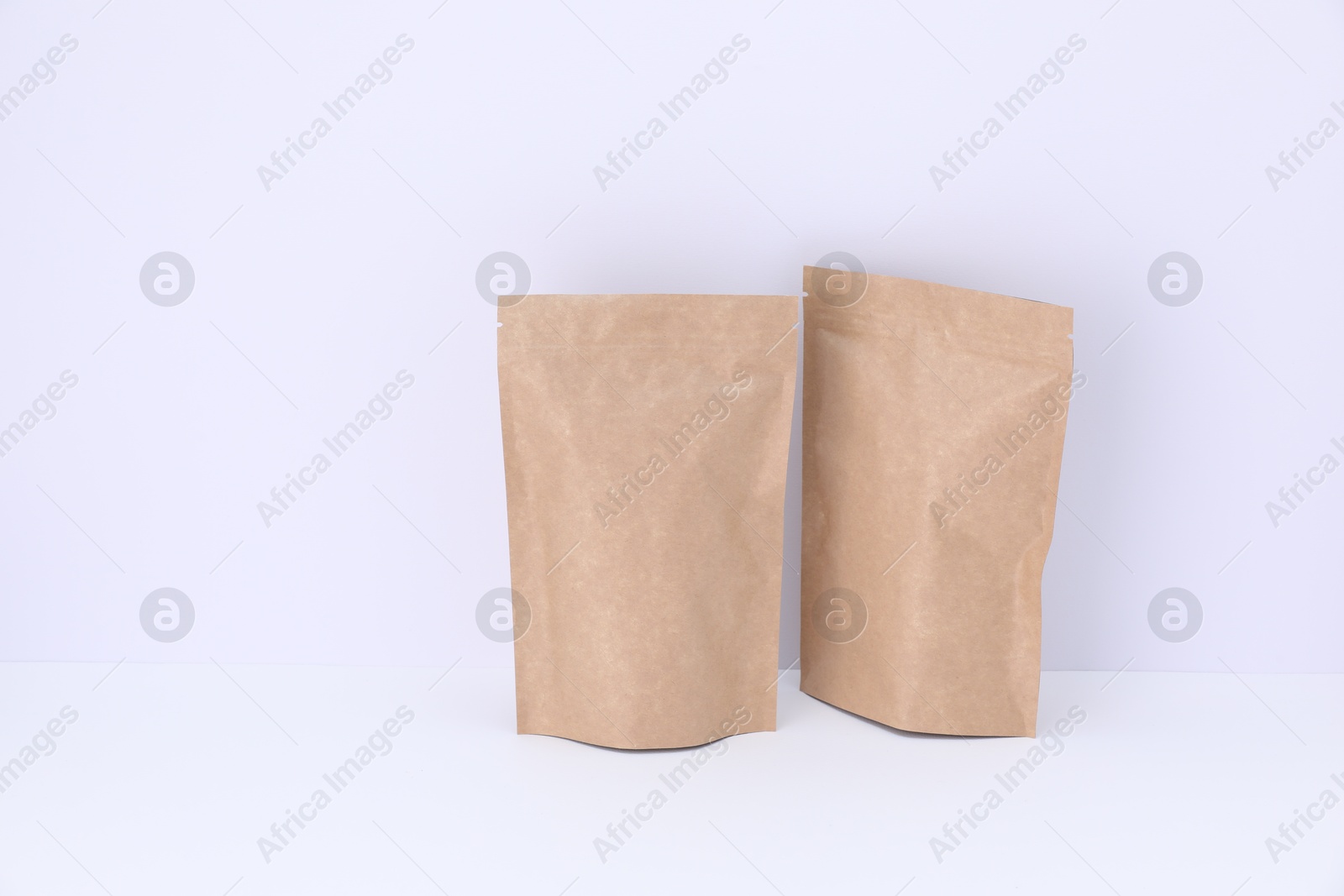 Zipper stand-up pouches on white background. Mockup for design Photo of Zipper stand-up pouches on white background. Mockup for design