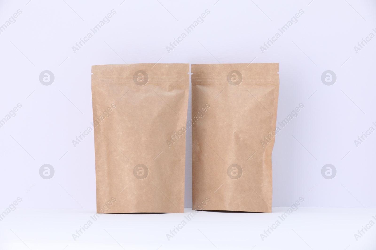 Zipper stand-up pouches on white background. Mockup for design Photo of Zipper stand-up pouches on white background. Mockup for design
