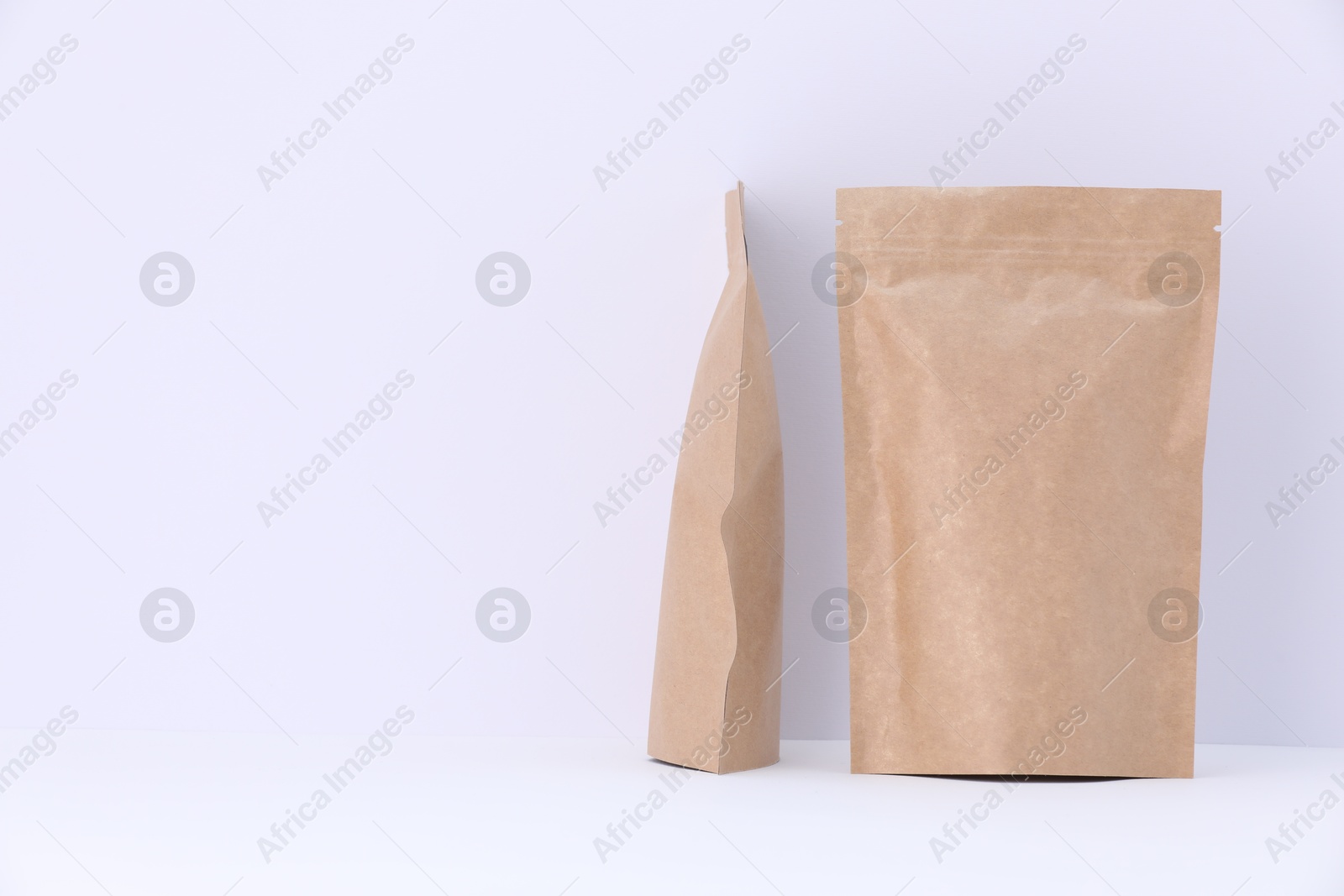 Zipper stand-up pouches on white background. Mockup for design Photo of Zipper stand-up pouches on white background. Mockup for design