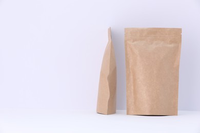 Photo of Zipper stand-up pouches on white background. Mockup for design