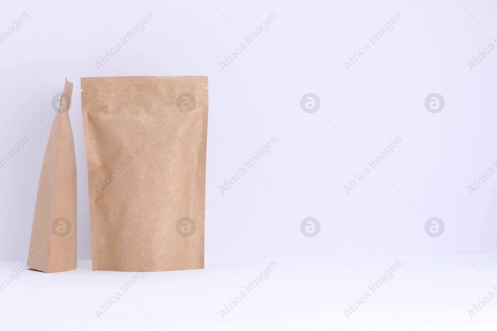 Zipper stand-up pouches on white background. Mockup for design Photo of Zipper stand-up pouches on white background. Mockup for design