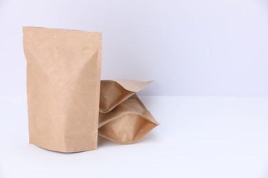 Photo of Zipper stand-up pouches on white background. Mockup for design