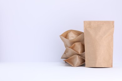 Photo of Zipper stand-up pouches on white background. Mockup for design