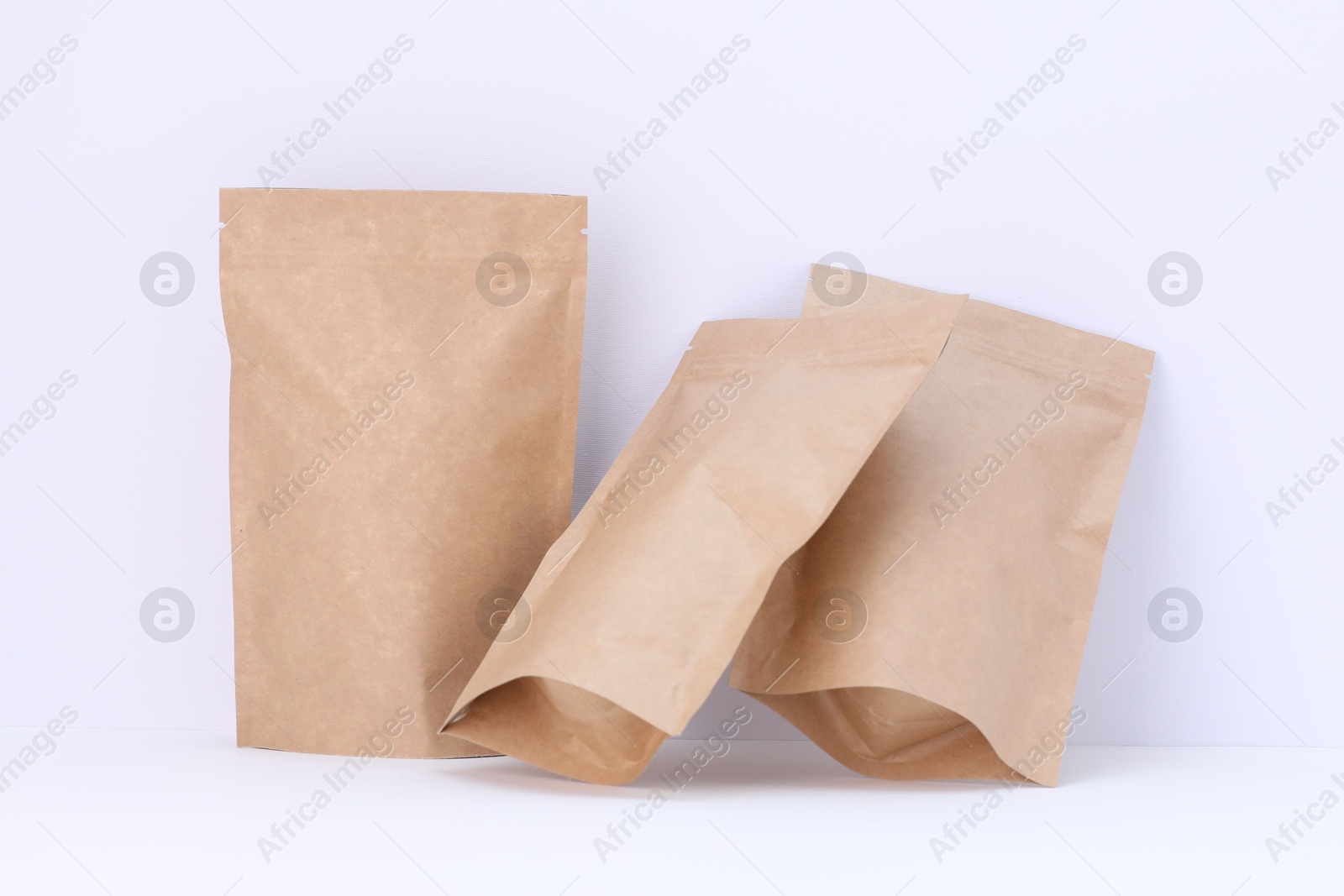 Zipper stand-up pouches on white background. Mockup for design Photo of Zipper stand-up pouches on white background. Mockup for design