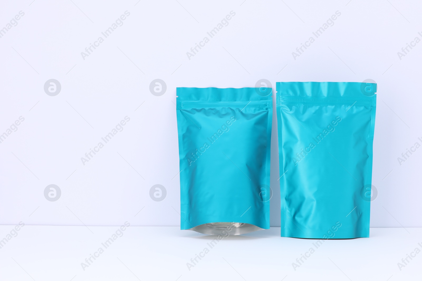 Zipper stand-up pouches on white background. Mockup for design Photo of Zipper stand-up pouches on white background. Mockup for design