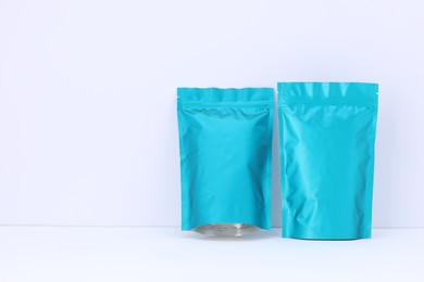 Photo of Zipper stand-up pouches on white background. Mockup for design