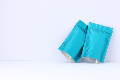 Photo of Zipper stand-up pouches on white background. Mockup for design