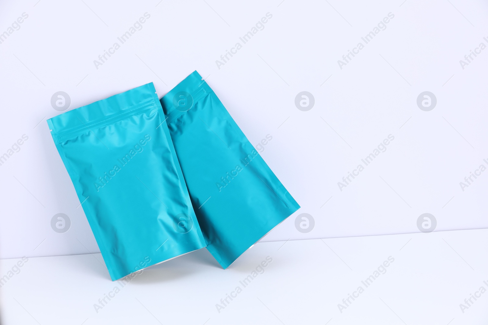 Zipper stand-up pouches on white background. Mockup for design Photo of Zipper stand-up pouches on white background. Mockup for design