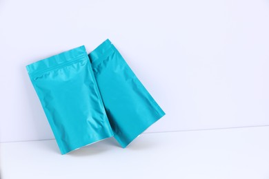 Photo of Zipper stand-up pouches on white background. Mockup for design
