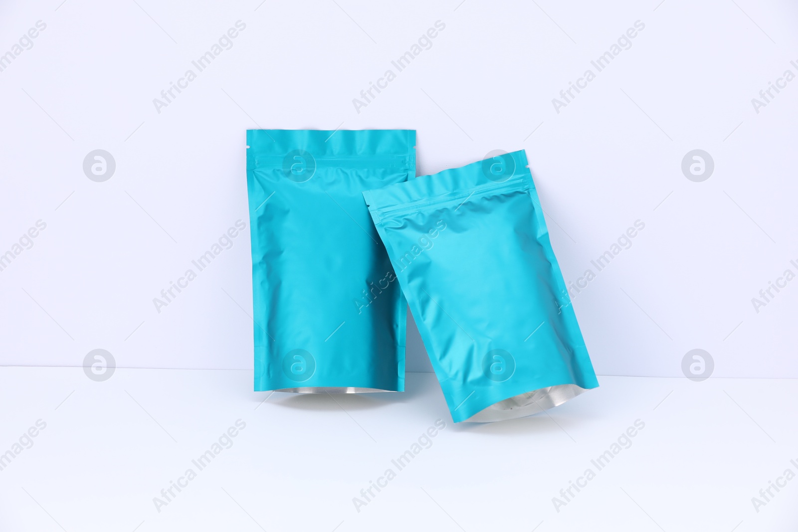 Zipper stand-up pouches on white background. Mockup for design Photo of Zipper stand-up pouches on white background. Mockup for design