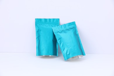 Photo of Zipper stand-up pouches on white background. Mockup for design
