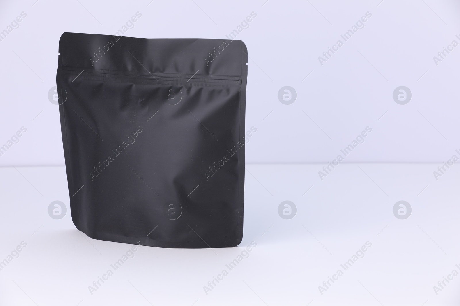 Zipper stand-up pouch on white background. Mockup for design Photo of Zipper stand-up pouch on white background. Mockup for design