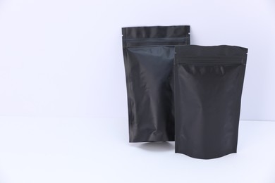 Photo of Zipper stand-up pouches on white background. Mockup for design