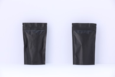 Photo of Zipper stand-up pouches on white background. Mockup for design
