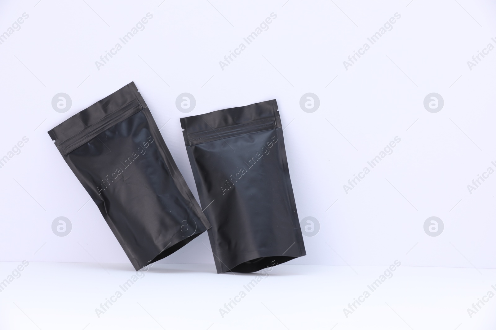Zipper stand-up pouches on white background. Mockup for design Photo of Zipper stand-up pouches on white background. Mockup for design