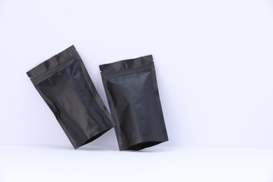Photo of Zipper stand-up pouches on white background. Mockup for design