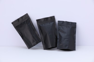 Photo of Zipper stand-up pouches on white background. Mockup for design