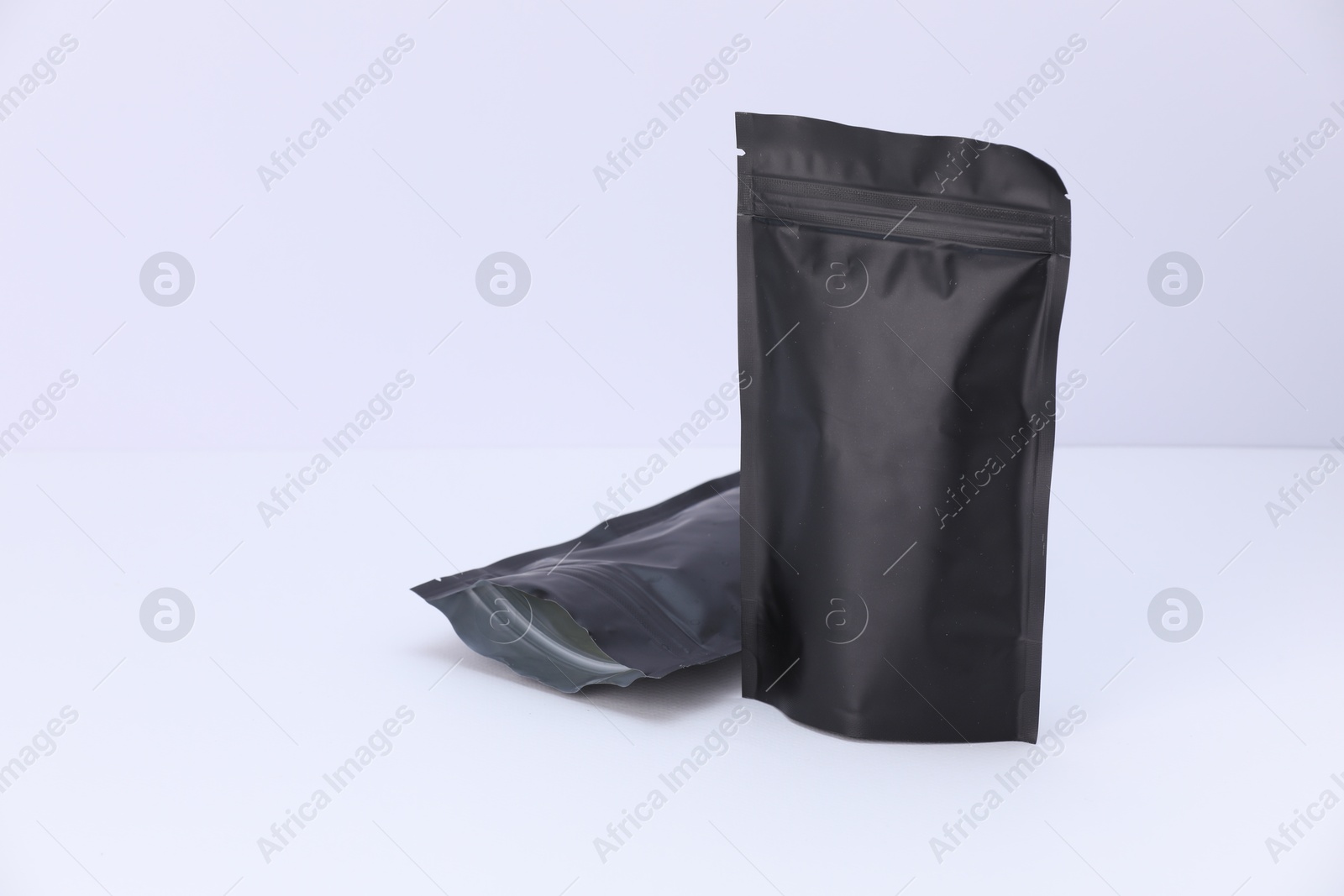 Zipper stand-up pouches on white background. Mockup for design Photo of Zipper stand-up pouches on white background. Mockup for design