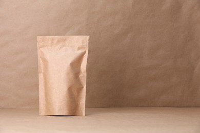 Photo of Zipper stand-up pouch on kraft paper background. Mockup for design
