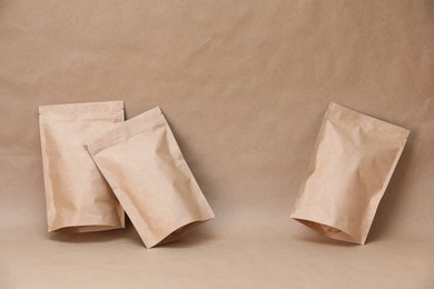 Photo of Zipper stand-up pouches on kraft paper background. Mockup for design
