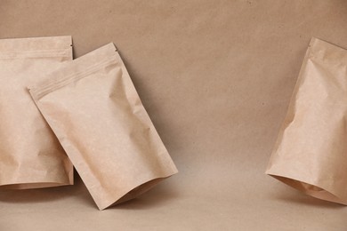 Photo of Zipper stand-up pouches on kraft paper background. Mockup for design