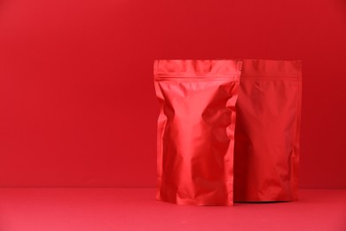 Photo of Zipper stand-up pouches on red background. Mockup for design