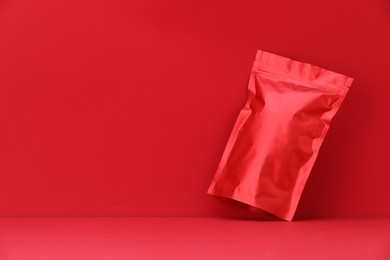 Photo of Zipper stand-up pouch on red background. Mockup for design