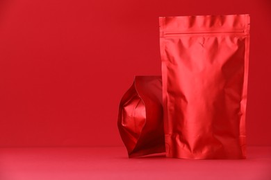 Photo of Zipper stand-up pouches on red background. Mockup for design