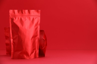 Photo of Zipper stand-up pouches on red background. Mockup for design
