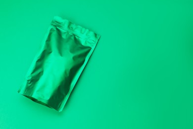 Photo of Zipper stand-up pouch on green background. Mockup for design