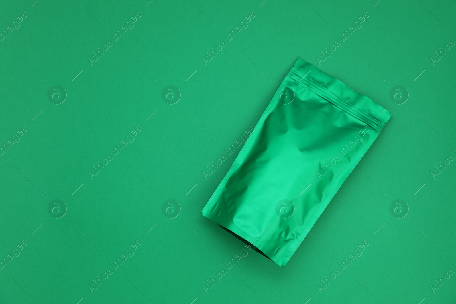 Zipper stand-up pouch on green background. Mockup for design Photo of Zipper stand-up pouch on green background. Mockup for design