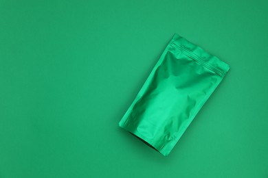 Photo of Zipper stand-up pouch on green background. Mockup for design