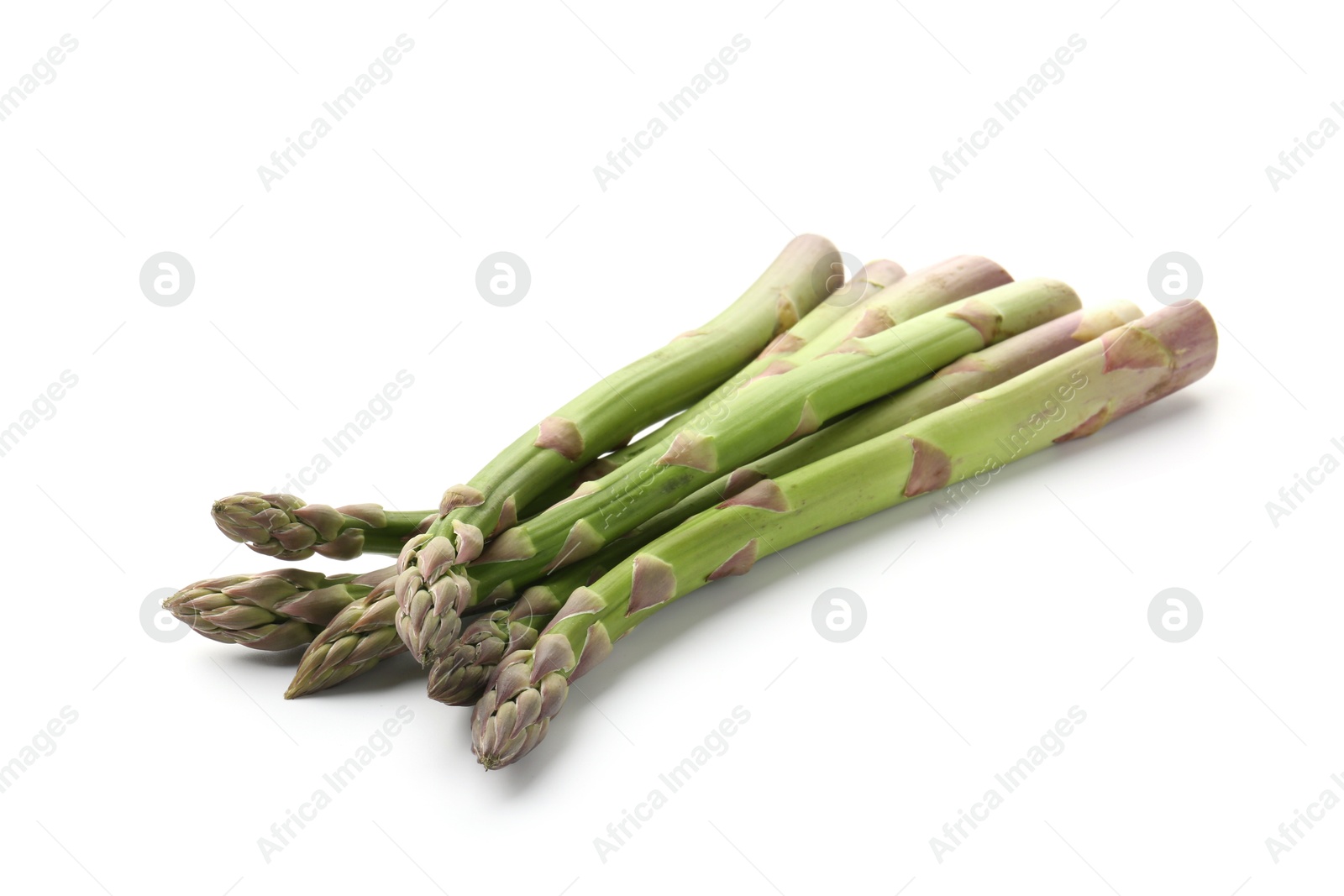 Fresh raw asparagus spears isolated on white Photo of Fresh raw asparagus spears isolated on white