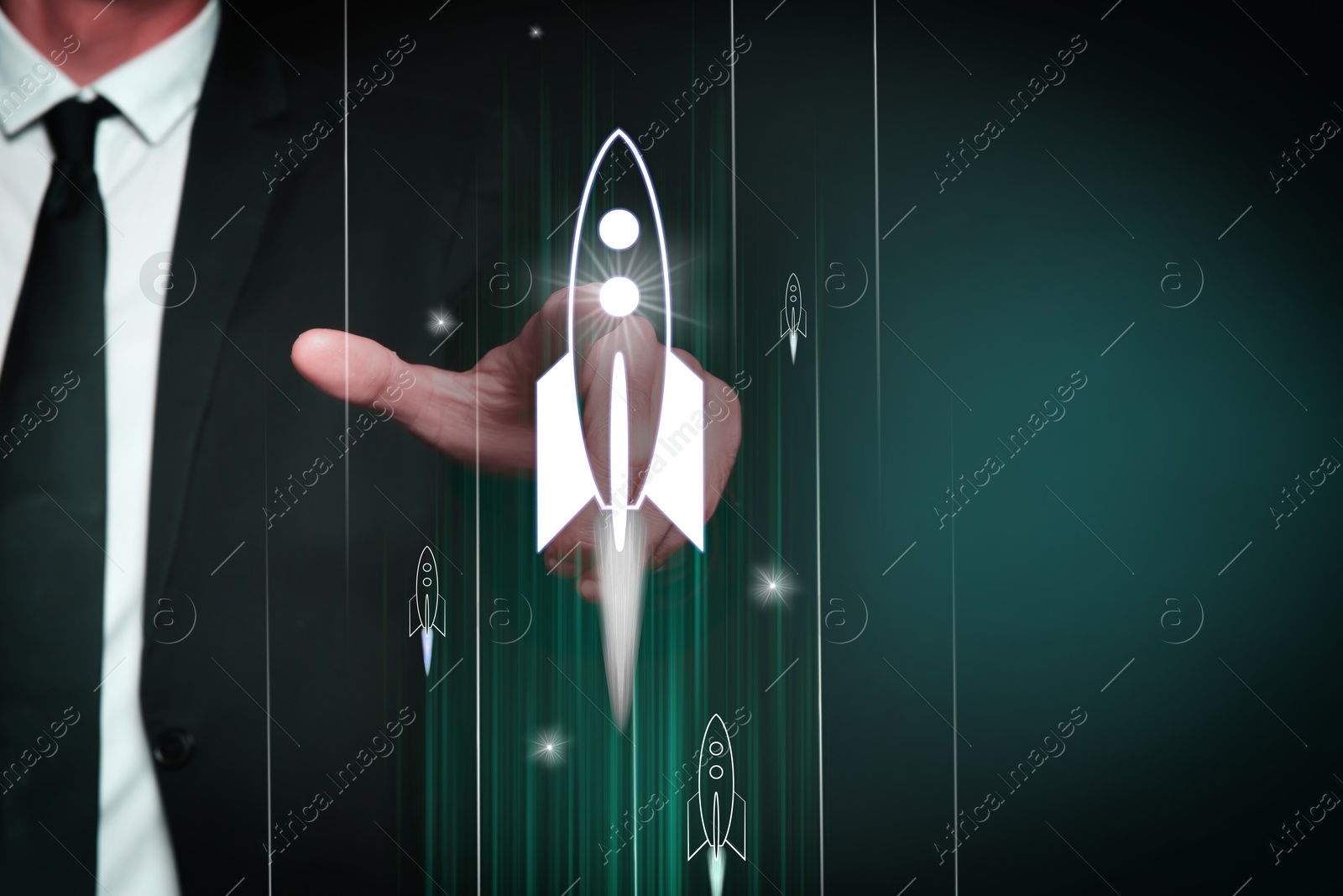 Business, successful startup. Man launching rocket on virtual screen against dark green background, closeup Image of Business, successful startup. Man launching rocket on virtual screen against dark green background, closeup