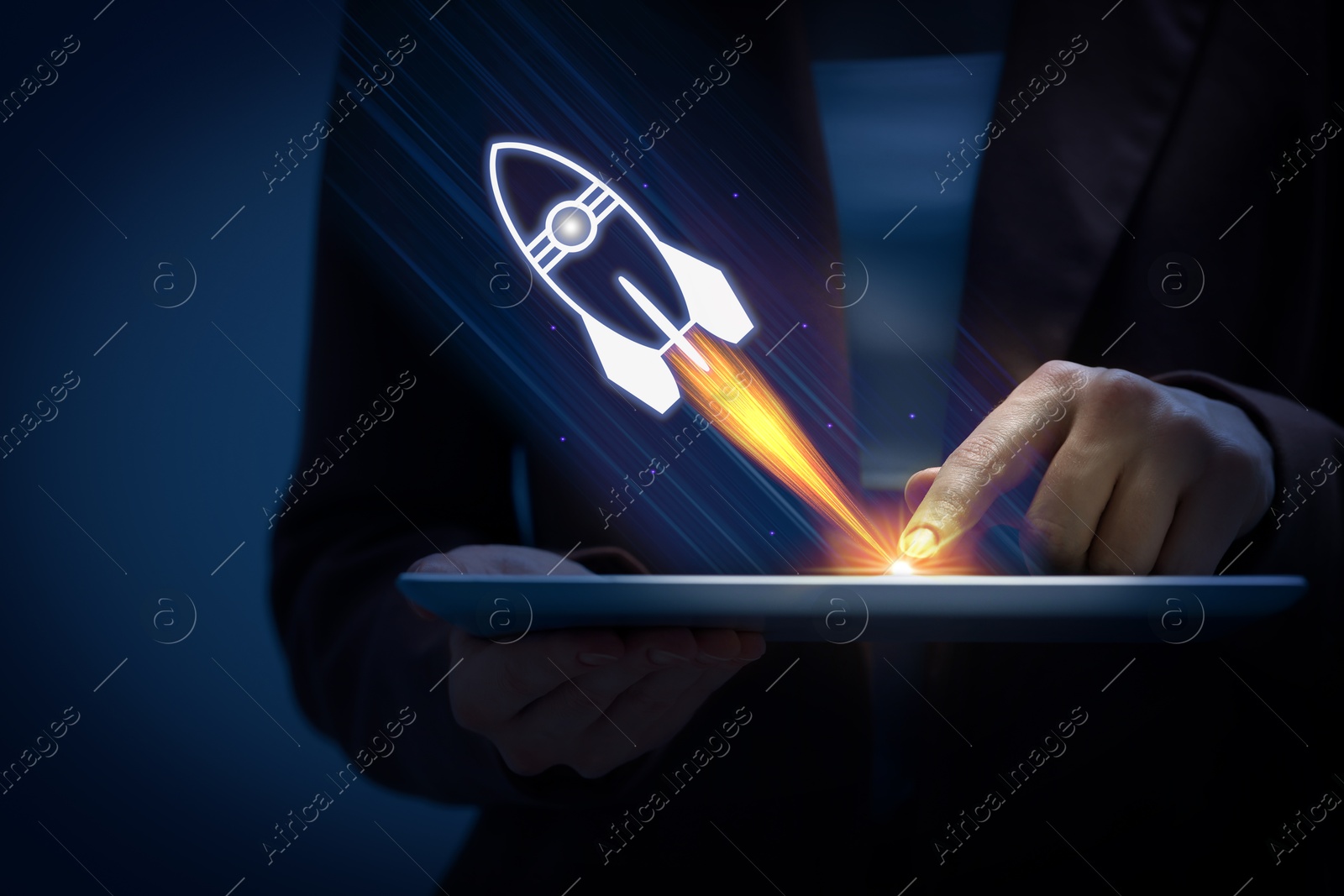 Business, successful startup. Woman using tablet computer against dark background, closeup. Rocket launching from device Image of Business, successful startup. Woman using tablet computer against dark background, closeup. Rocket launching from device