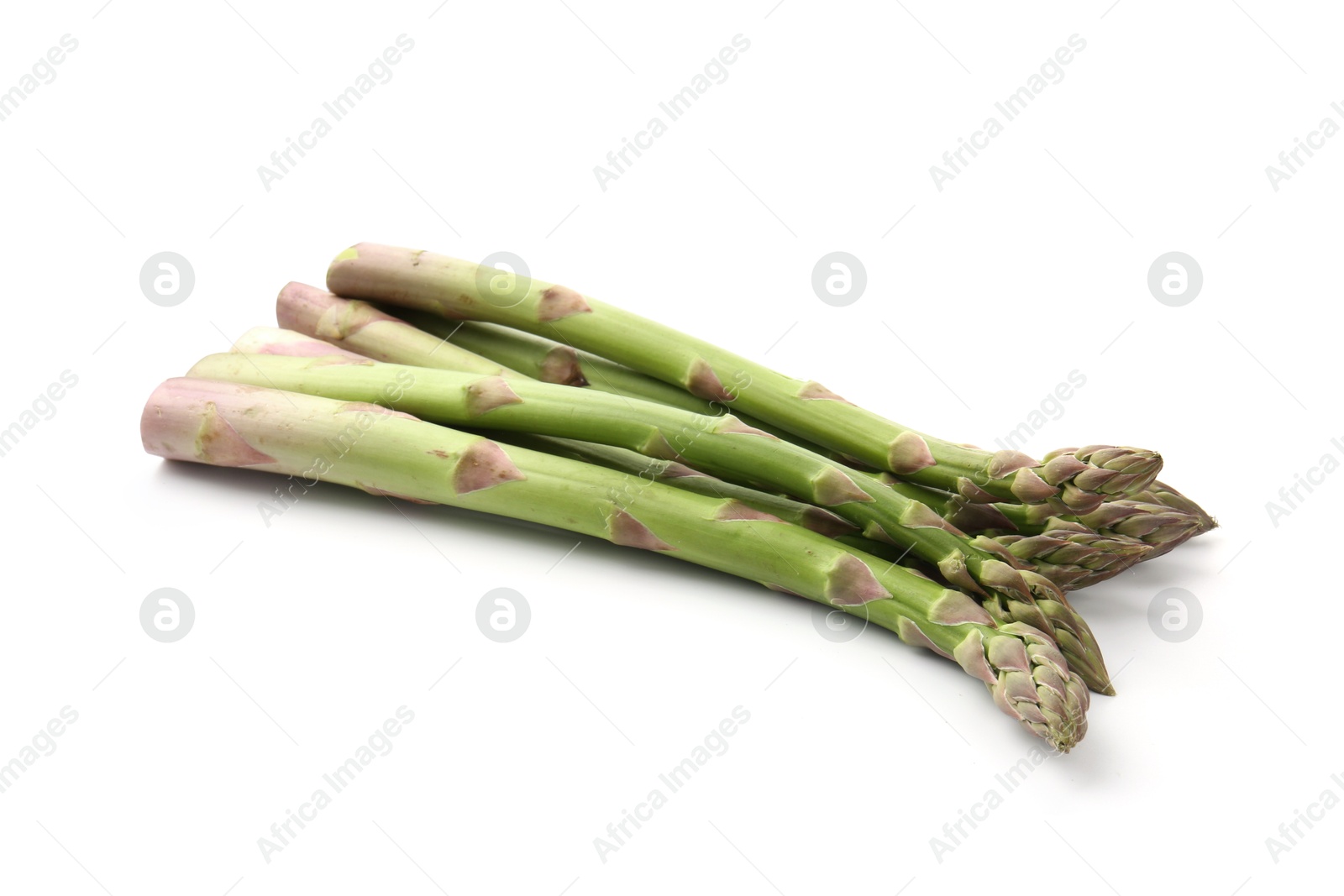 Fresh raw asparagus spears isolated on white Photo of Fresh raw asparagus spears isolated on white