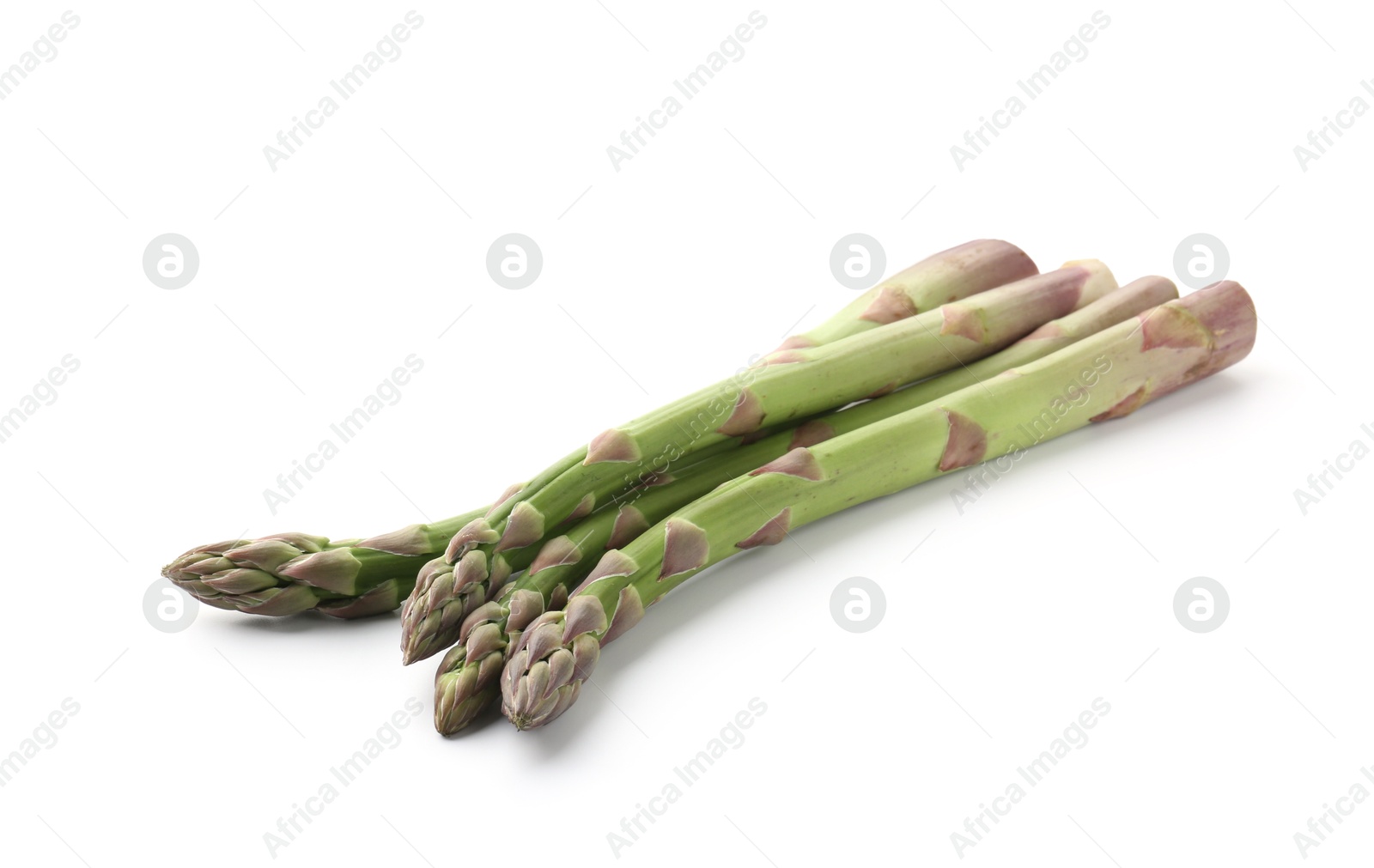 Fresh raw asparagus spears isolated on white Photo of Fresh raw asparagus spears isolated on white