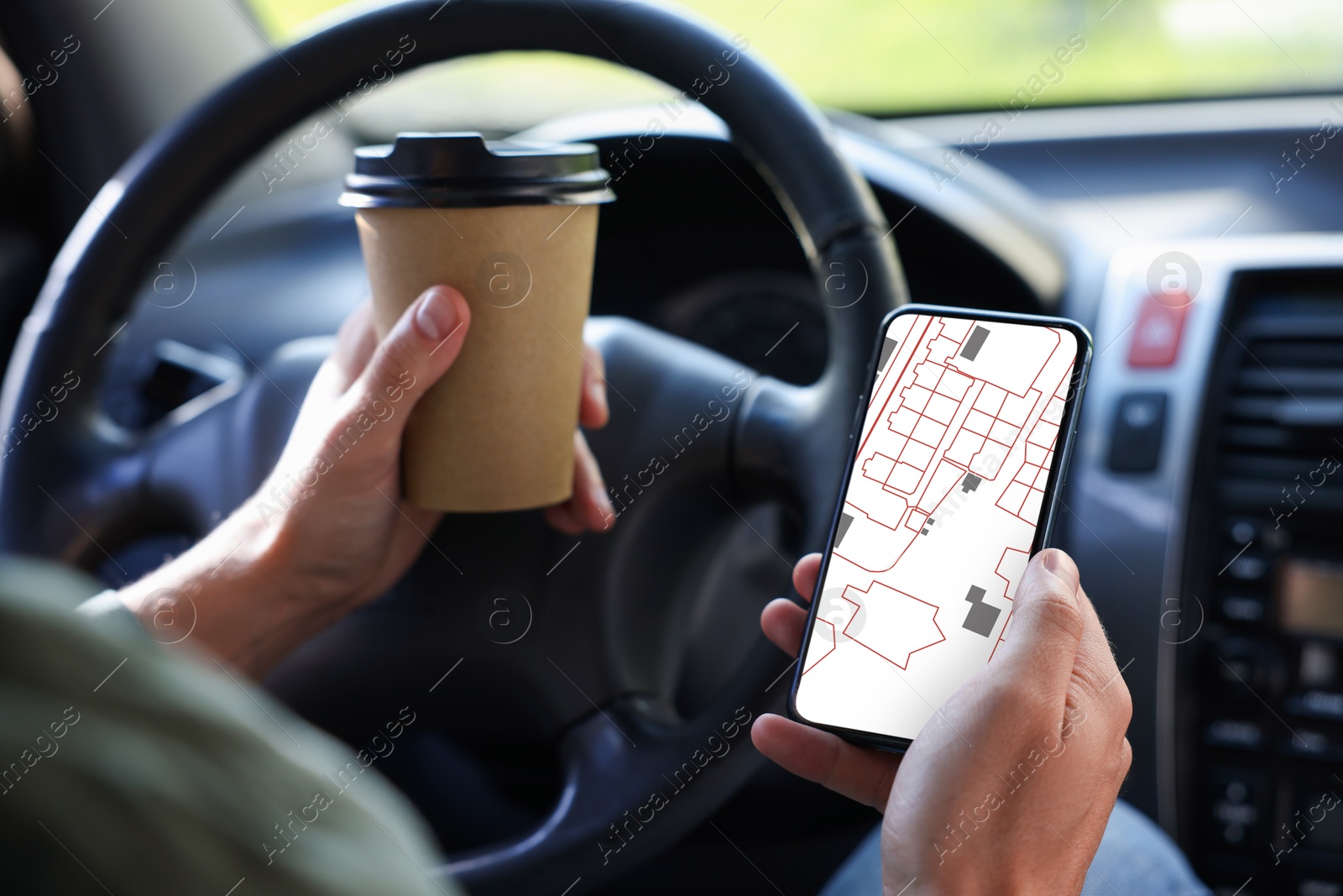 Man looking at city map on his mobile phone in car, closeup. Navigation app on device Image of Man looking at city map on his mobile phone in car, closeup. Navigation app on device