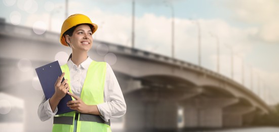 Image of Construction engineer with clipboard against bridge outdoors. Banner design