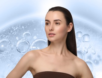 Image of Beautiful woman against collagen serum with bubbles