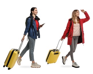 Image of Women with suitcases walking on white background