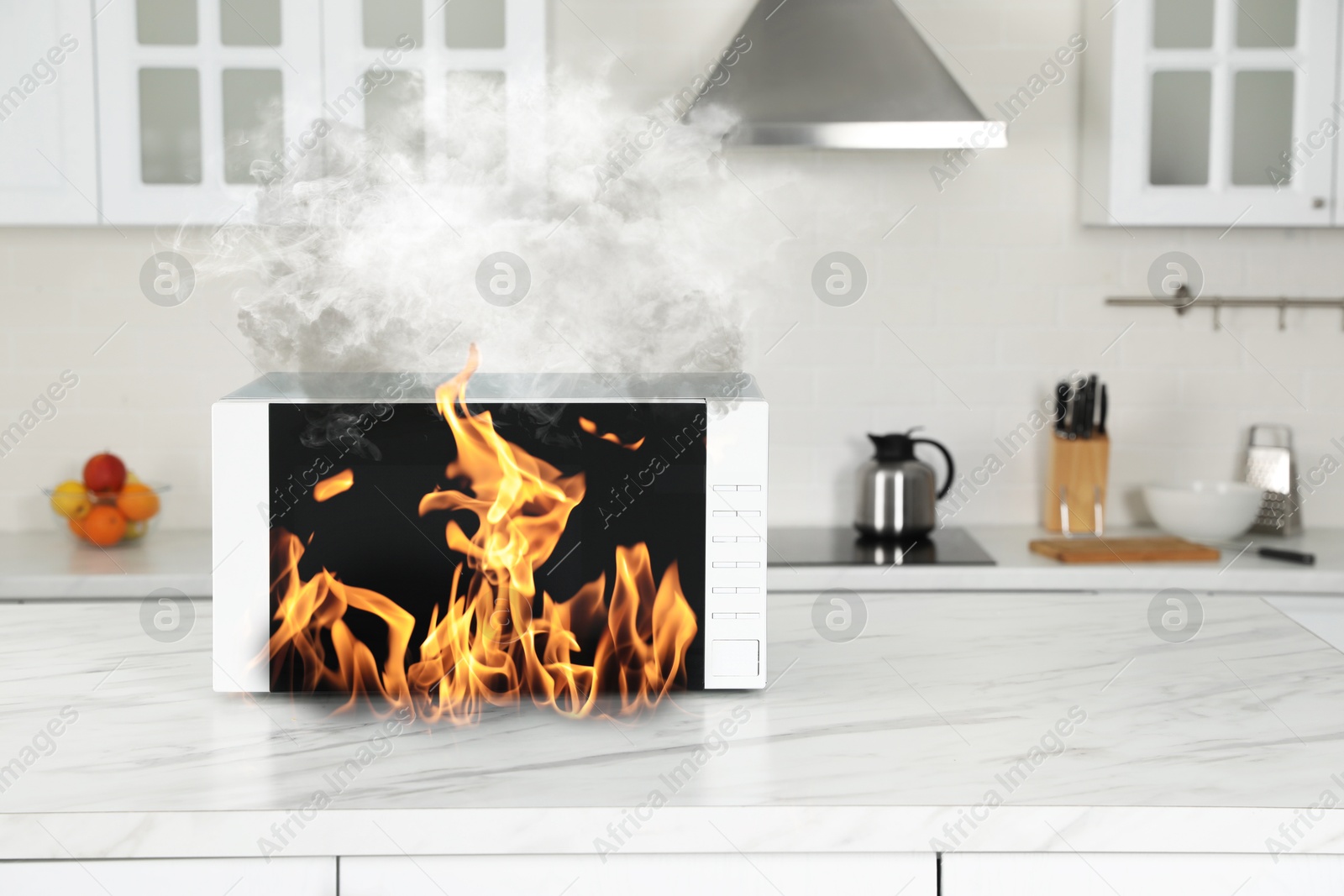 Microwave oven burning inside on table in kitchen Image of Microwave oven burning inside on table in kitchen
