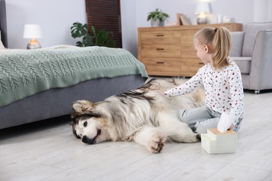 Photo of Girl suffering from allergy with her dog at home