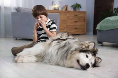 Photo of Boy suffering from allergy with her dog at home