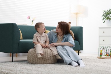 Photo of Happy mother spending time together with her son at home