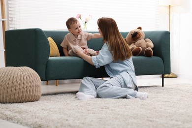 Photo of Mother spending time together with her son at home