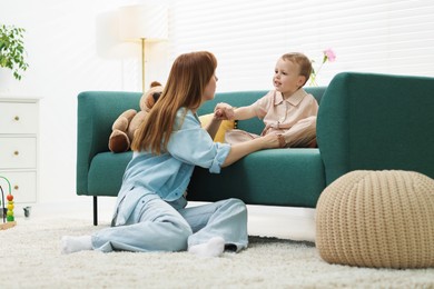 Photo of Mother spending time together with her son at home