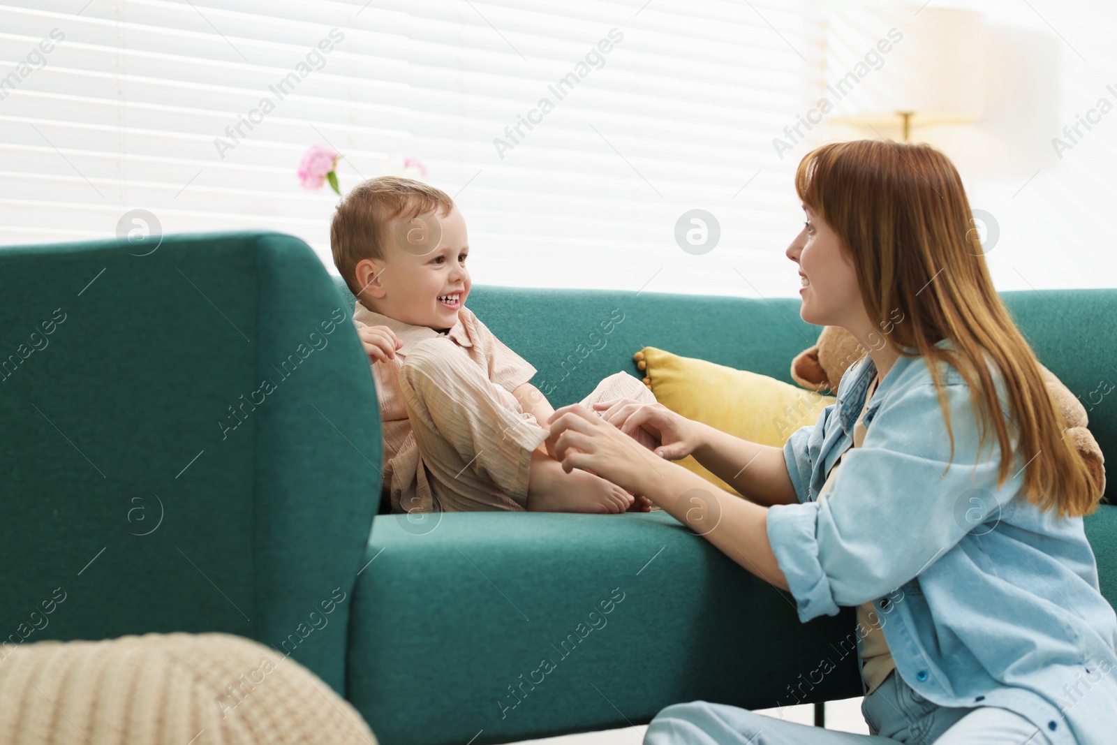 Happy mother spending time together with her son at home Photo of Happy mother spending time together with her son at home