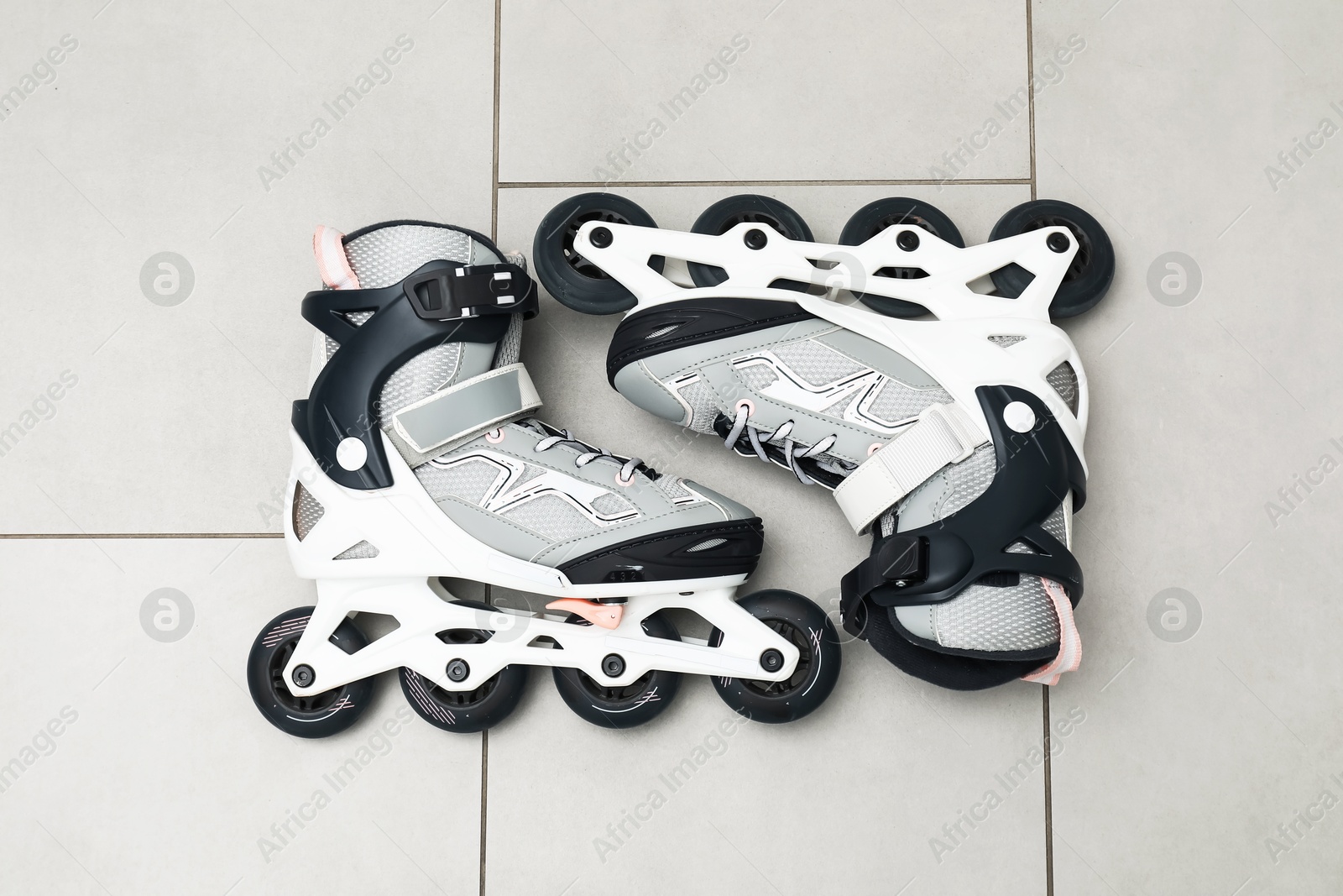 Pair of roller skates on floor, top view Photo of Pair of roller skates on floor, top view