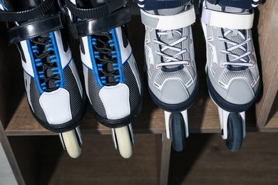 Photo of Pairs of roller skates in shelving unit, above view